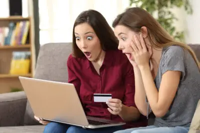 Astonished Roommates Buying On Line At Home